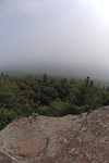 Escarpment overlooking foggy valley