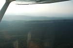 The Trapps cliff section in late evening sun.  Route 44/55 that leads up and through the break in the Shawangunk Ridge is seen here on the left.